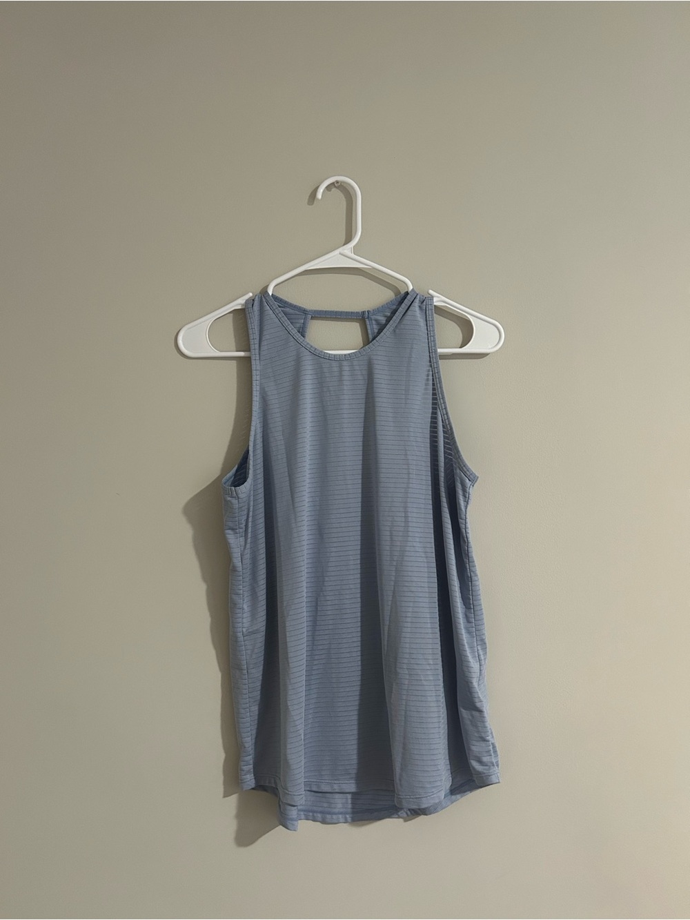 Blue athletic tank top with partial open back in size small